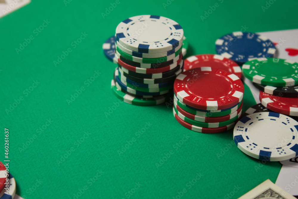 Classic playing cards, chips and dollars on green background with place for text. Gambling and casino concept. Classic playing cards, chips and dollars on green background with place for text. Gambling and casino concept.