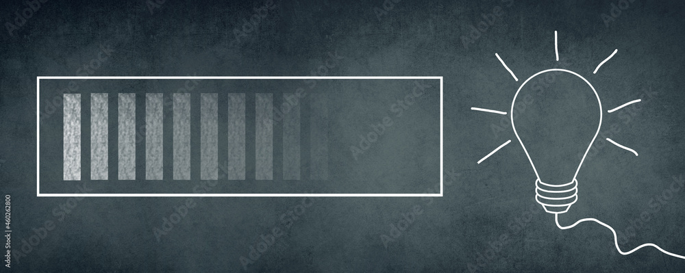 Loading sign and a lightbulb drawn on a chalkboard, brainstorming for ...