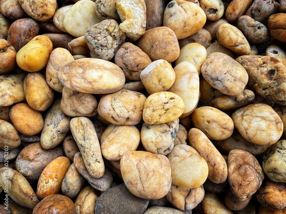 Many rocks piled up in landscape decoration. stones background wallpaper. Wet stones. Texture with stones. Background of small stones. Many rocks piled up in landscape decoration. stones background wallpaper. Wet stones. Texture with stones. Background of small stones.
