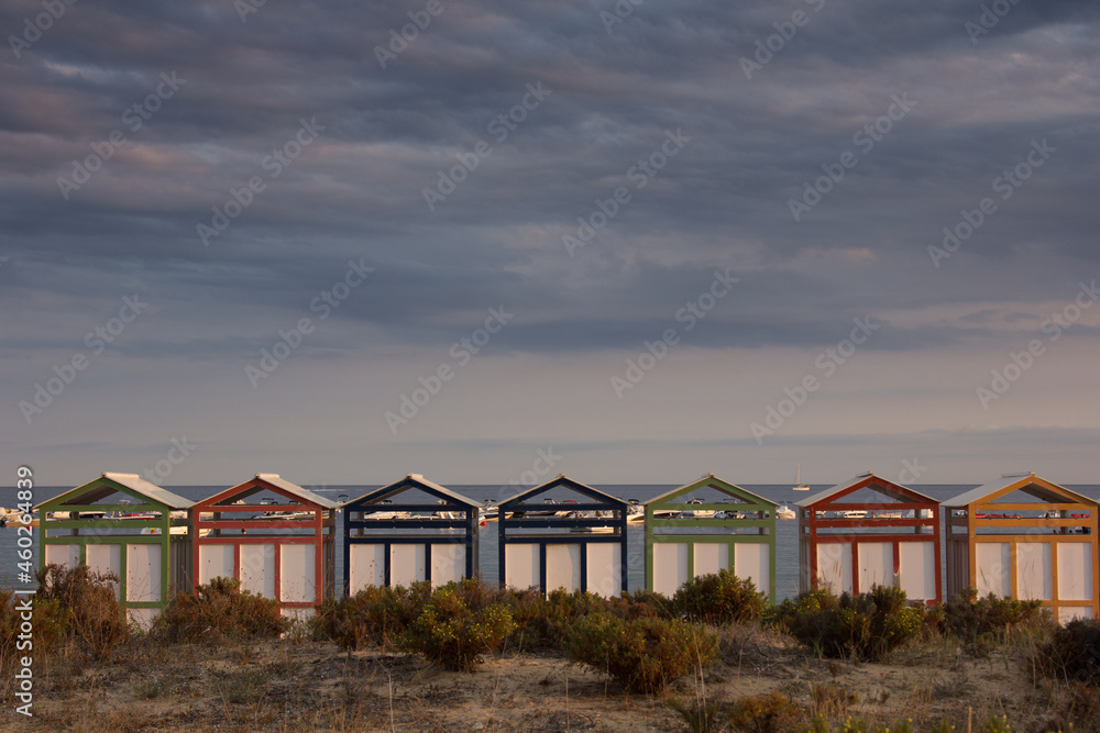 Multicolored bathing huts on the Costa Brava at the beach of Sant Pol, Sant Feliu de Guixols Multicolored bathing huts on the Costa Brava at the beach of Sant Pol, Sant Feliu de Guixols