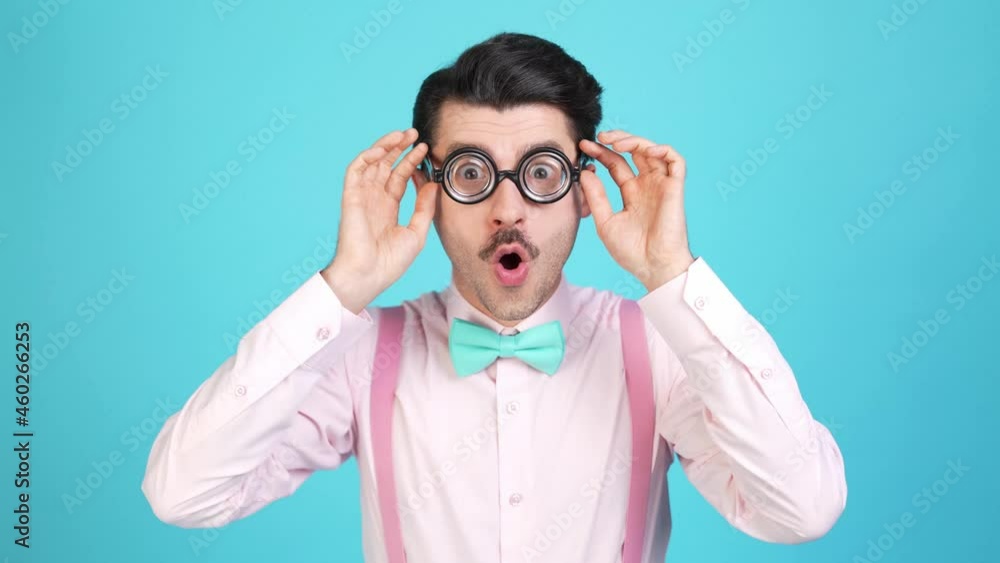 Excited crazy geek guy unbelievable sale reaction take off specs open mouth Excited crazy geek guy unbelievable sale reaction take off specs open mouth