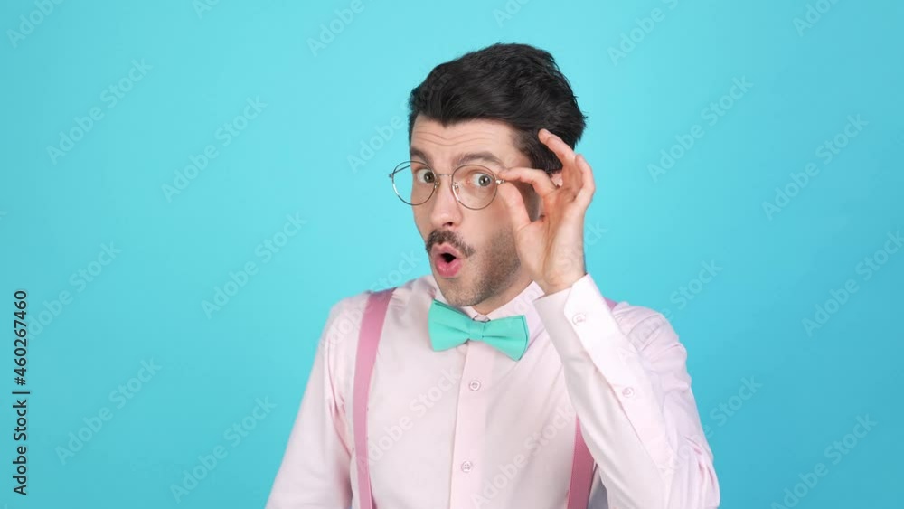 Funny geek guy curious attentive face take off eyewear express crazy reaction Funny geek guy curious attentive face take off eyewear express crazy reaction