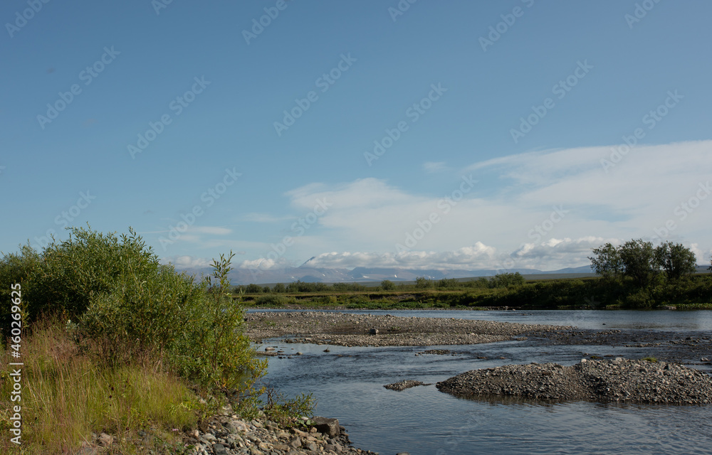 Summer river landscape with cloudy sky. Nature background, riverbank. Summer river landscape with cloudy sky. Nature background, riverbank.