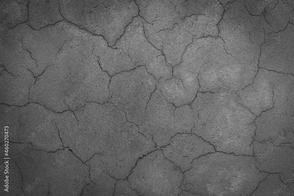 Fototapeta premium cracked concrete wall covered with gray cement surface as background black and white