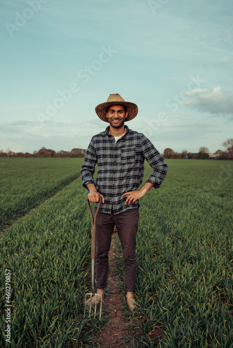 Mixed race male farmer standing in lush green fields © Prins Productions
