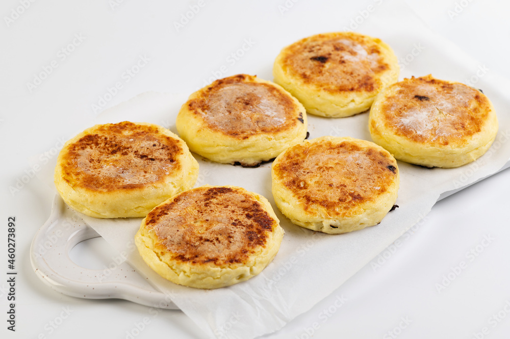 round cheesecakes, curds, on a white background