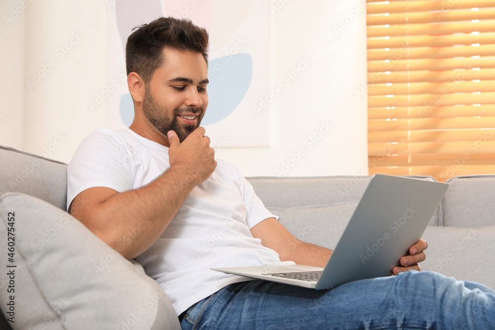 Man using laptop for online shopping at home Man using laptop for online shopping at home