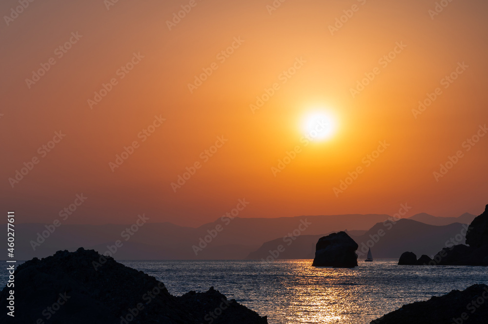 Golden sunset on the rocky seaside