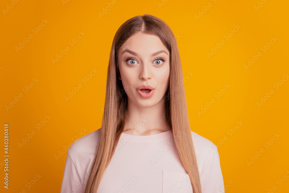 Portrait of shocked speechless stunned lady look camera open mouth on yellow background Portrait of shocked speechless stunned lady look camera open mouth on yellow background