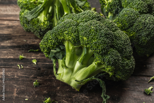 Wallpaper Mural Green fresh broccoli on old wooden background. Ripe vegetables for diet and healthy eating Torontodigital.ca