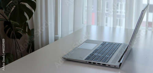 Banner of a working place at home with a laptop. Minimalism interior