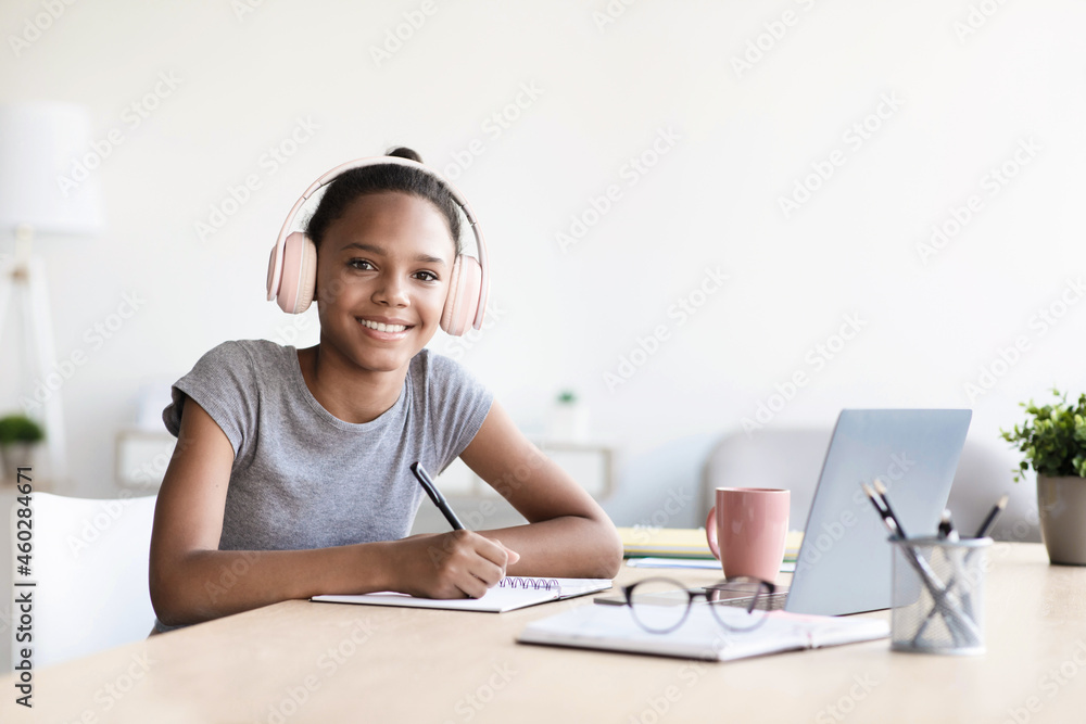 Afro american kid studying using computer, preschool child at home school Afro american kid studying using computer, preschool child at home school