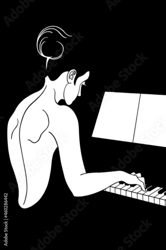 A beautiful woman in an evening dress plays the piano.