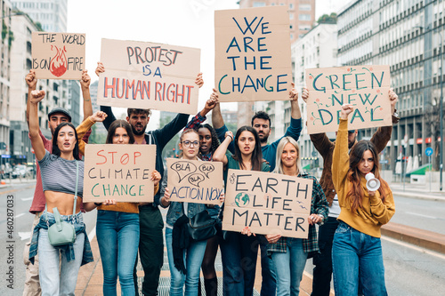 fridays for future protest on city street - young activists movement against global warming photo