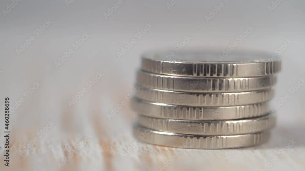 Small coins fall on a pile. Macro view. Shallow depth of field Small coins fall on a pile. Macro view. Shallow depth of field