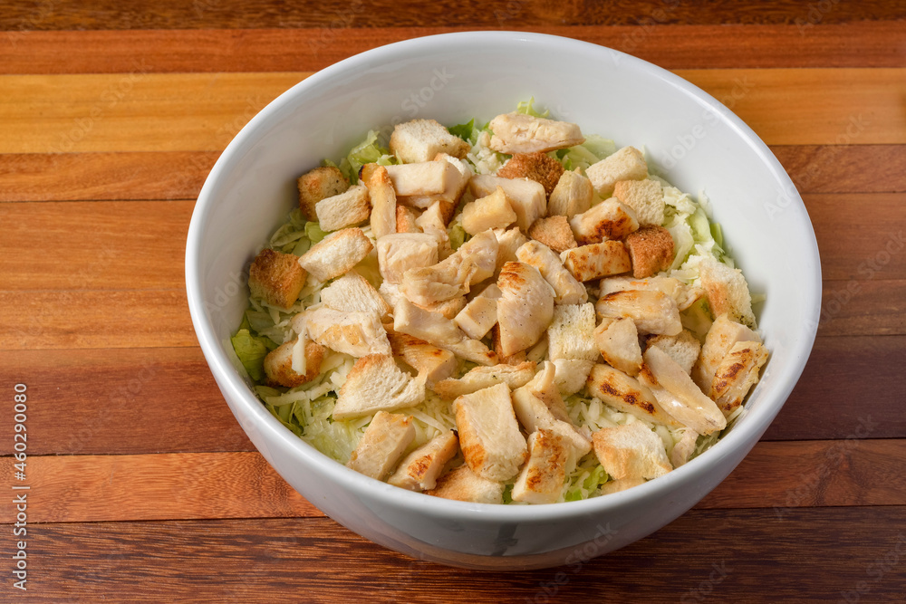 Chicken salad with vegetables in a white bowl. Chicken salad with vegetables in a white bowl.