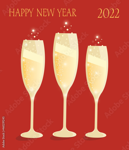 Happy New Year. 2022. Elegant golden shapan on a red background. Glasses of champagne. Holiday. Family celebration. Sparkling drink.