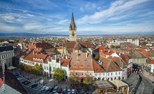 Aerial overview of Sibiu, Romania from the Council Tower with the Small Square (Piata Mica) and the ramp heading to the Lower town, while the Evanghelical Lutheran Cathedral dominates the skyline.