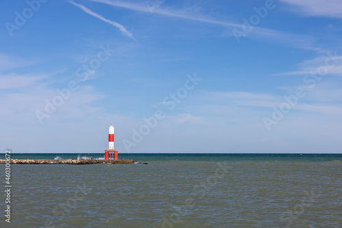 A Marker Light Tower On A Breakwater Along Lake Michigan