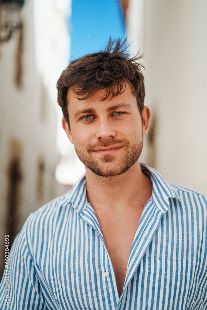 Man looking at camera on sunny day Man looking at camera on sunny day