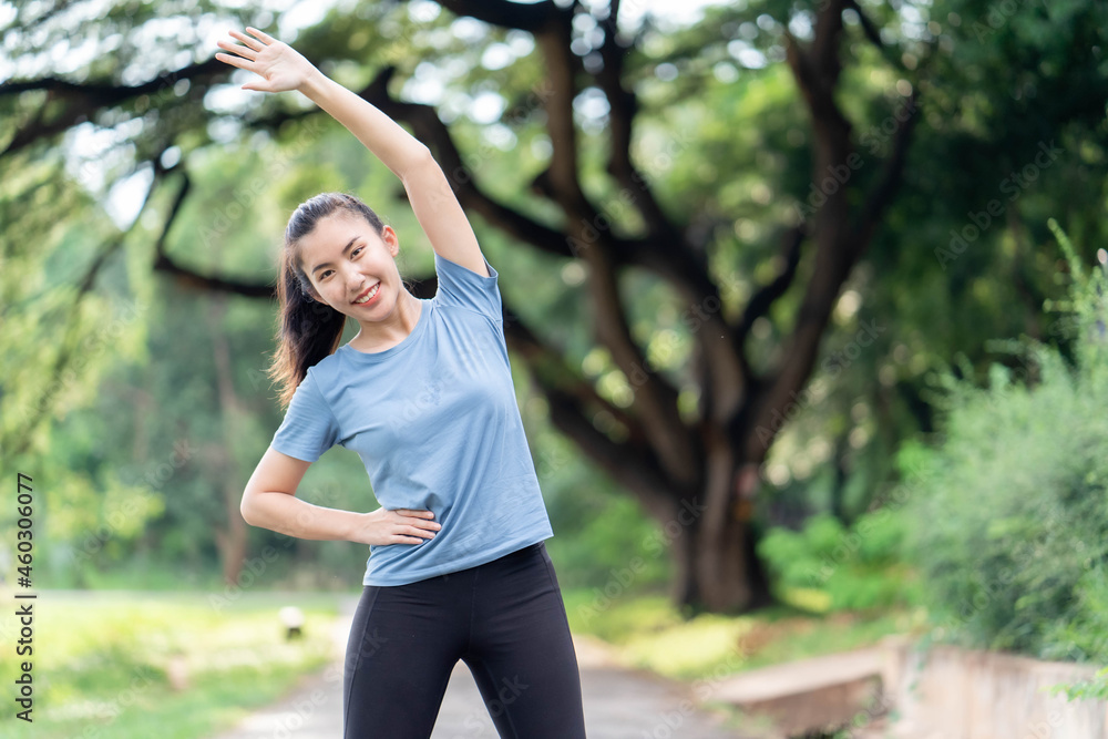 Asian women stretching and warm up before exercise Asian women stretching and warm up before exercise