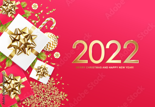 2022 Merry Christmas and Happy New Year banner with gift boxes  golden glitter snowflakes  balls  fir tree  candys and confetti on red background. Vector ilustration.