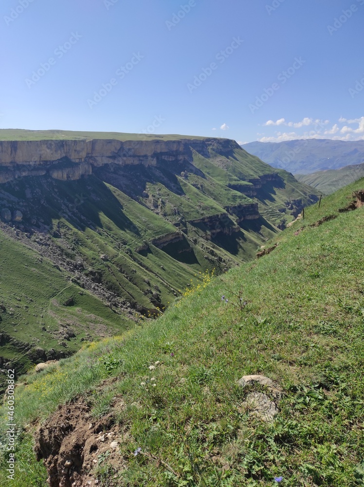 green mountains against the blue sky green mountains against the blue sky