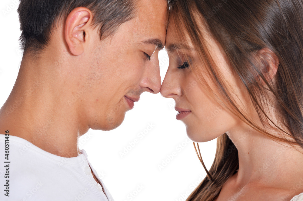 Happy young couple posing isolated on white background Happy young couple posing isolated on white background