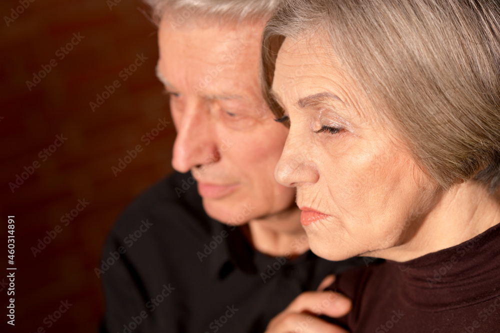 Portrait of cute sad senior couple posing at home Portrait of cute sad senior couple posing at home