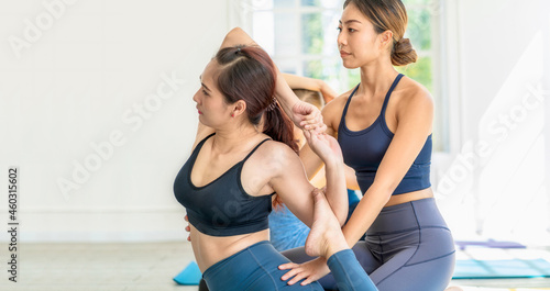 Group of diversity yoga sport people practice with their Coaching in yoga class, Asian Yoga instructor woman support young asian sport man for yoga training, banner or panorama ratio