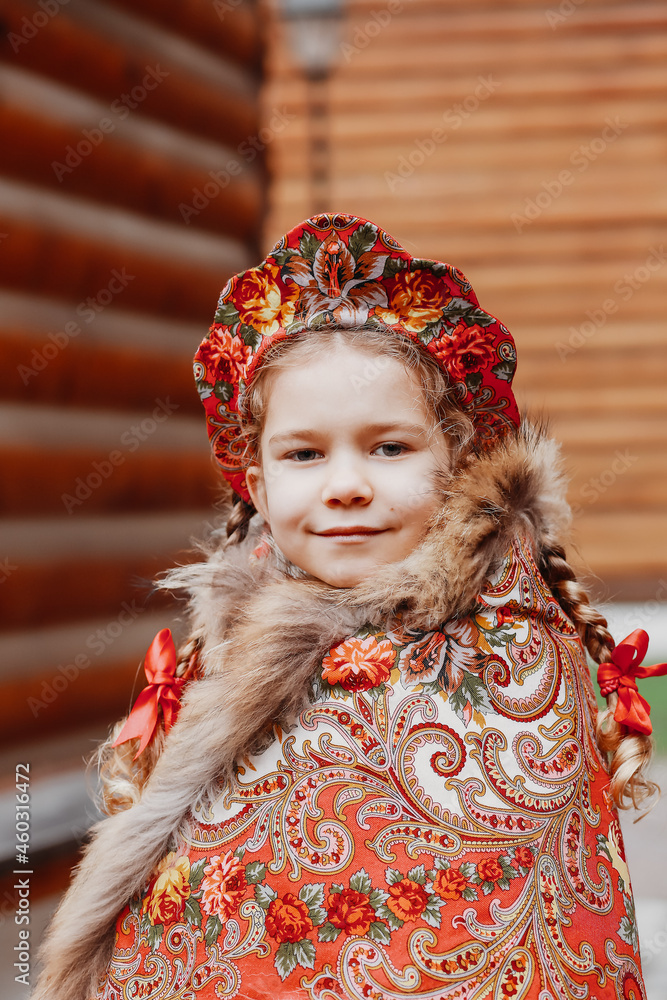 a Russian girl in a red national costume