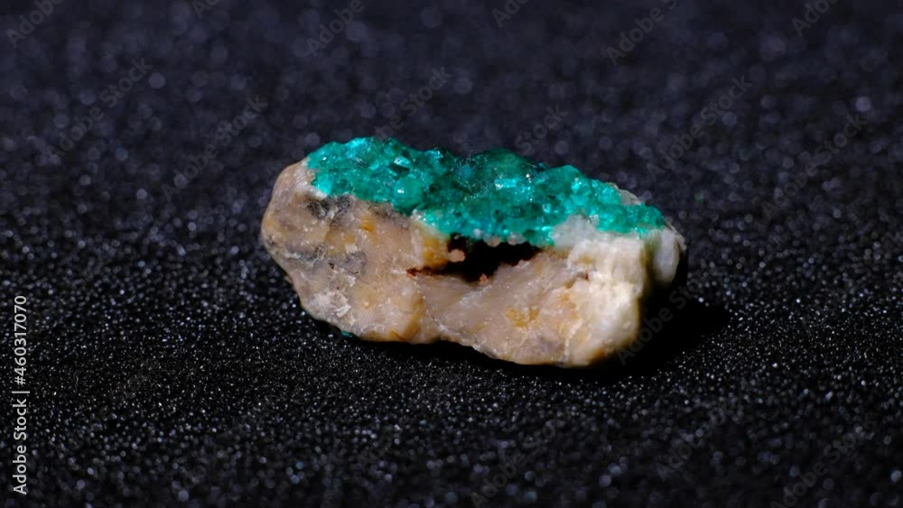 Dioptase crystal gemstone rotate on black background. Dioptase crystal gemstone rotate on black background.