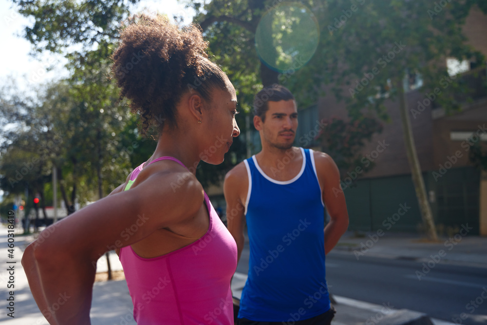 Obraz premium Young ethnic couple working out together outdoors