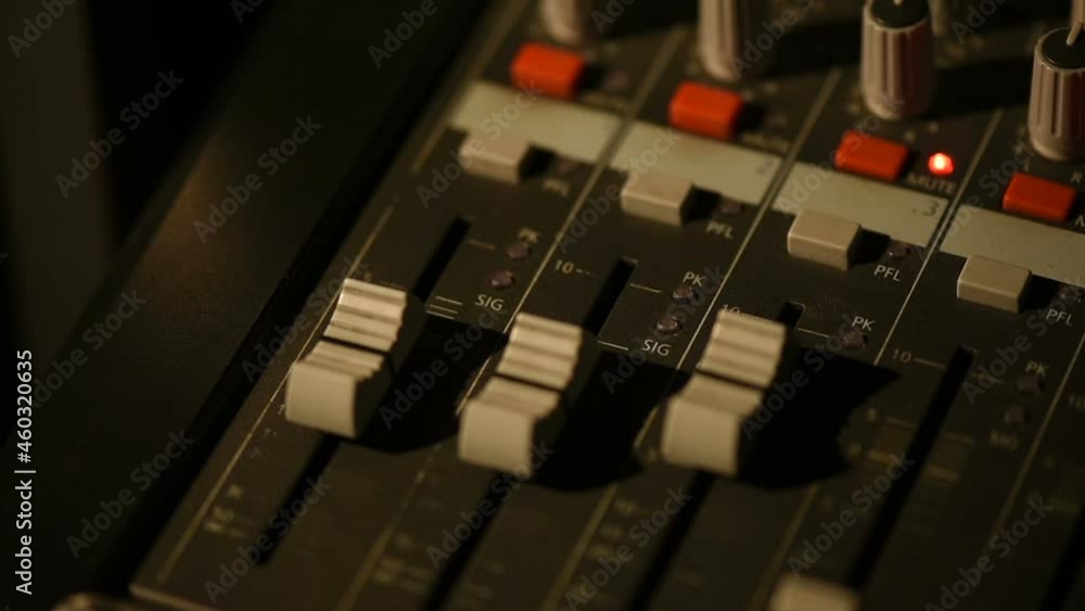 Adjust mixer of sound for a concert. Adjust mixer of sound for a concert.