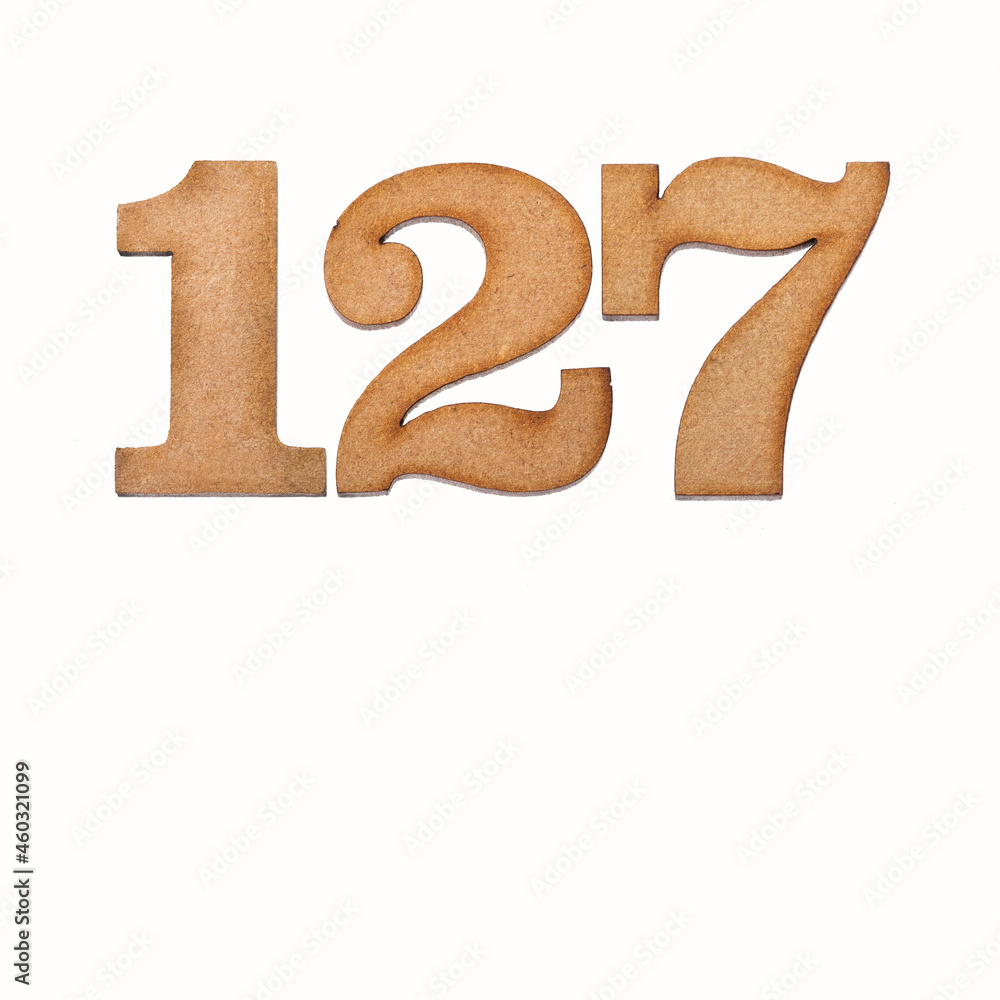 Number 127 in wood, isolated on white background Number 127 in wood, isolated on white background