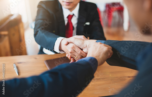 Teamwork colleagues business handshake after meeting. Businessman shaking hands to seal a deal with his partner.