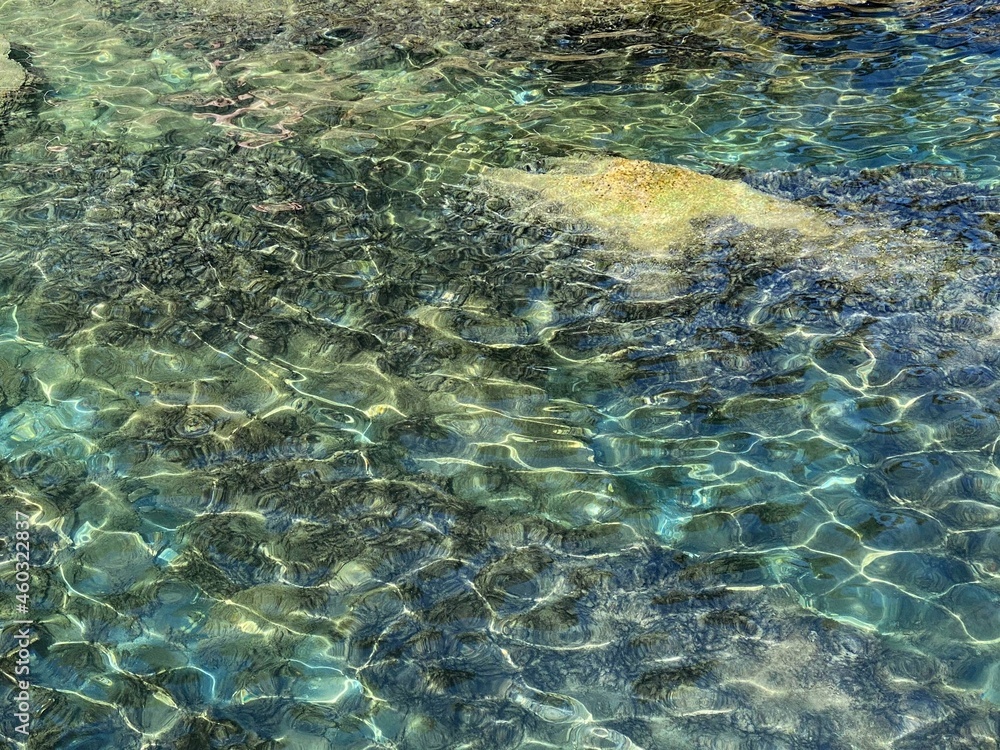 Jade green turquoise sea water surface. Beautiful transparent water of tropical lagoon. Amazing marine seascape. Incredible watercolor background.