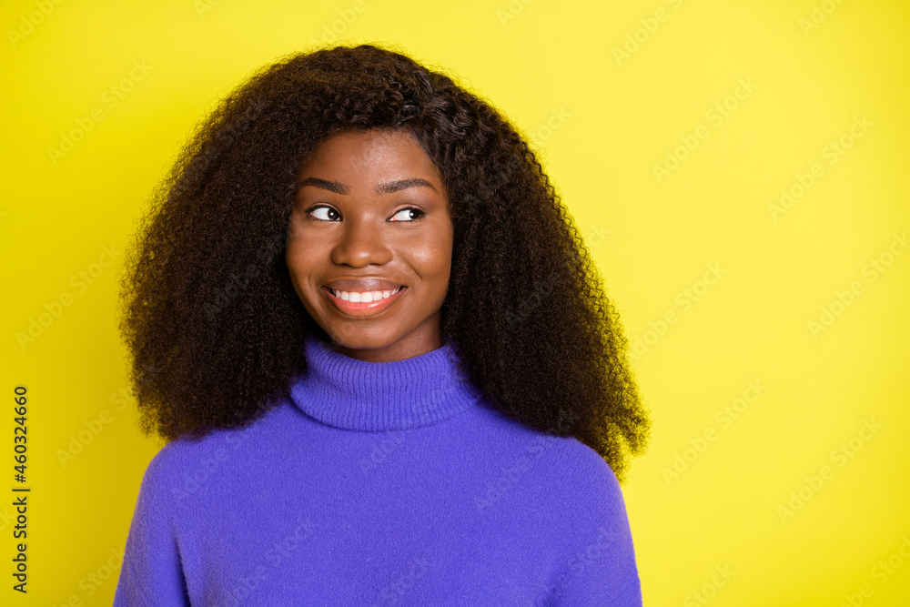Photo of funny curious lady look side empty space wear violet sweater isolated yellow color background Photo of funny curious lady look side empty space wear violet sweater isolated yellow color background
