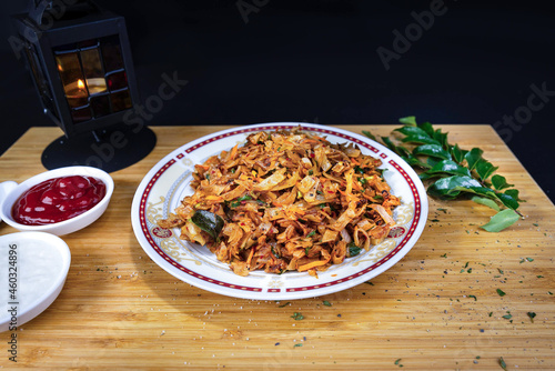 Traditional Sri Lankan kottu roti in wooden background