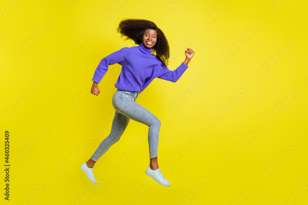 Full length profile photo of running cheerful dark ksin lady look have good mood isolated on yellow color background Full length profile photo of running cheerful dark ksin lady look have good mood isolated on yellow color background
