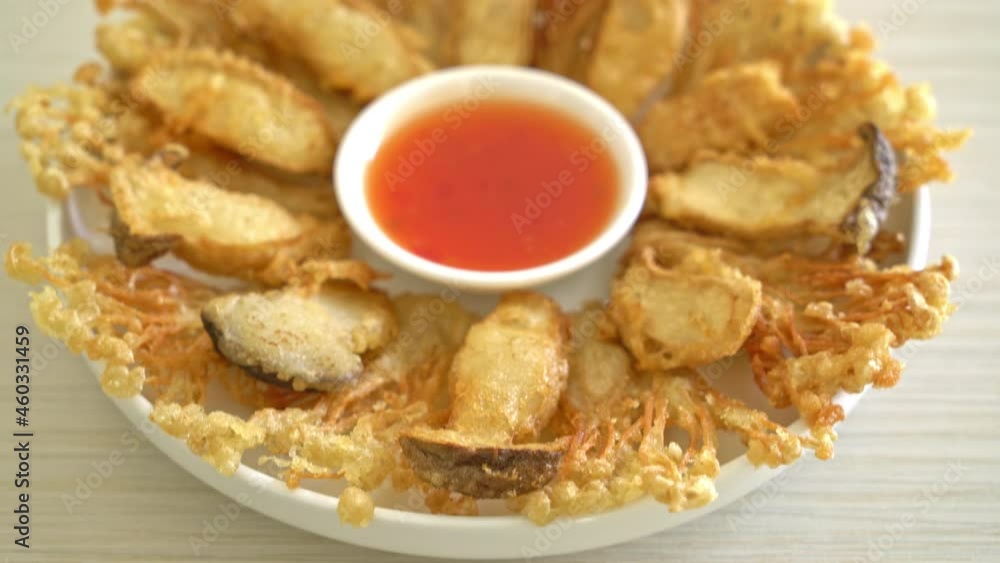 deep fried Enoki mushroom and King Oyster mushroom with spicy dipping sauce - vegan food style deep fried Enoki mushroom and King Oyster mushroom with spicy dipping sauce - vegan food style