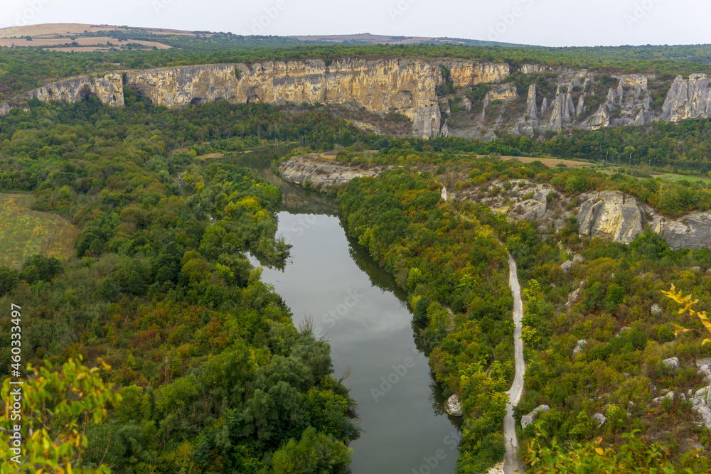 Aerial view of Iskar river, passing near village of Karlukovo, Bulgaria. Balkan mountains around.