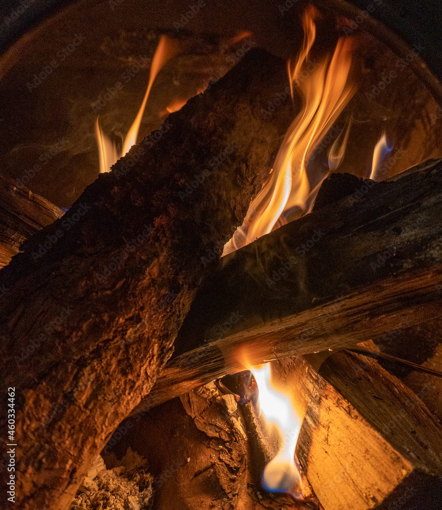 Hot coals and flames emitting from a hot burning fire. Hot coals and flames emitting from a hot burning fire.