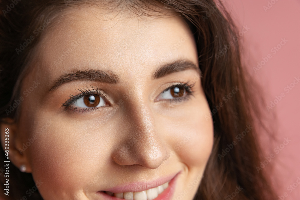 Obraz premium Close-up portrait of young beautiful girl without makeup isolated over pink studio background. Natural beauty concept.