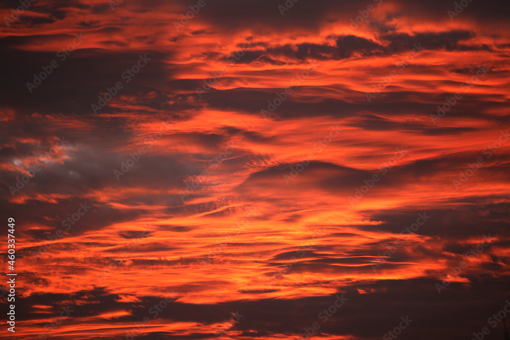 Red sky at sunset , layers of red and orange and yellow fiery sky