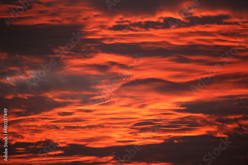 Red sky at sunset , layers of red and orange and yellow fiery sky