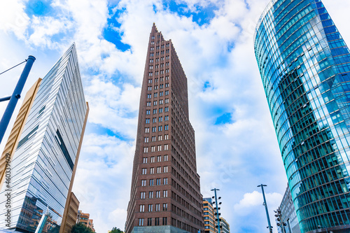 Cityscape of three modernist skyscraper office commercial buildings towering skyward