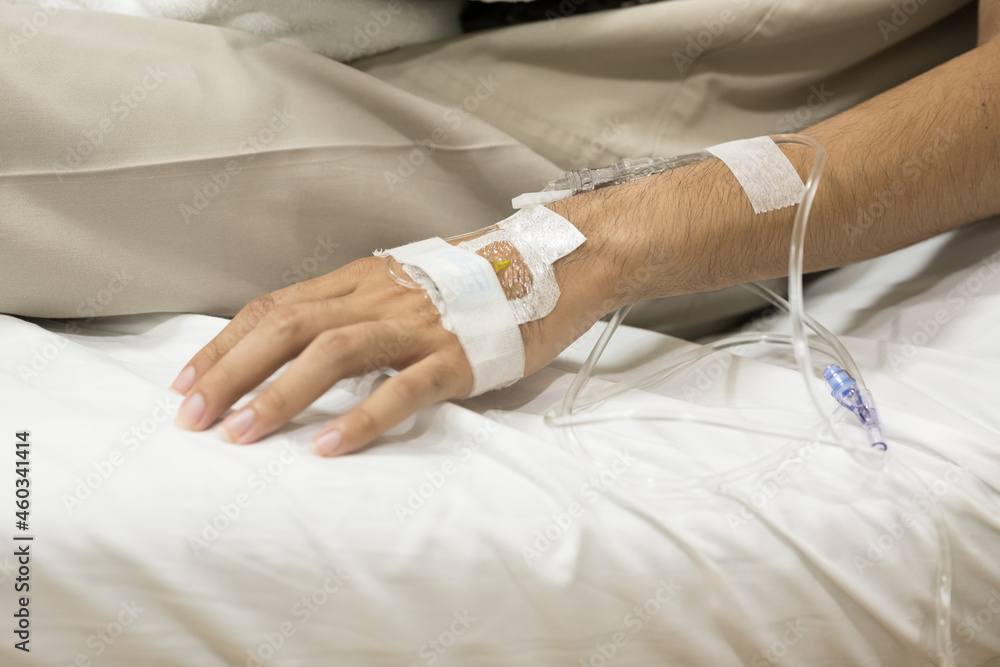 Fototapeta premium Close up set iv fluid intravenous drop saline drip for accident and seriously patient in hospital room.Medical treatment emergency patient.Medical treatment and cure concept.