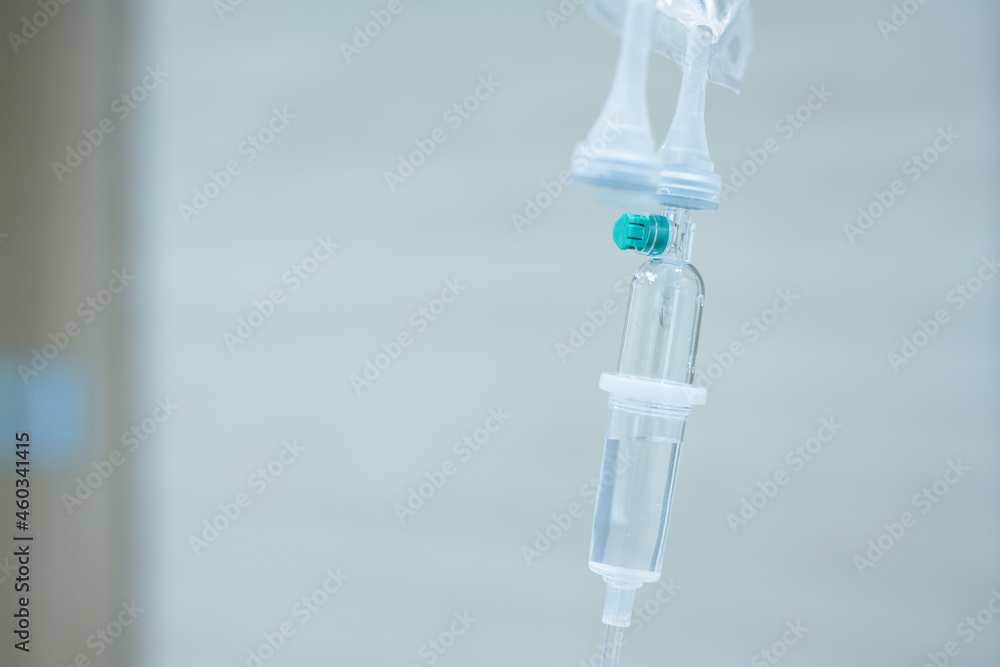 Close up set iv fluid intravenous drop saline drip for accident and seriously patient in hospital room.Medical treatment emergency patient.Medical treatment and cure concept. Close up set iv fluid intravenous drop saline drip for accident and seriously patient in hospital room.Medical treatment emergency patient.Medical treatment and cure concept.