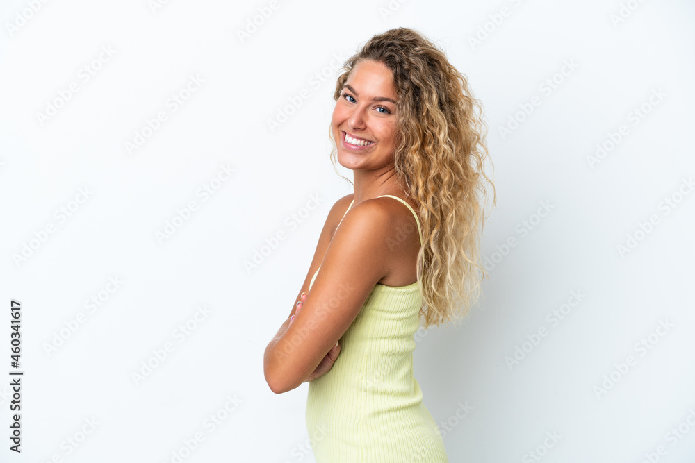 Girl with curly hair isolated on white background with arms crossed and looking forward Girl with curly hair isolated on white background with arms crossed and looking forward